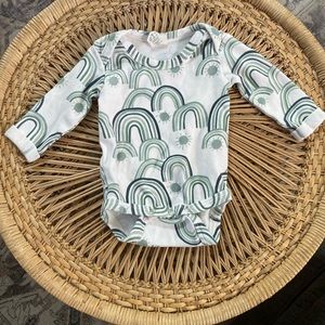 Kate Quinn lap neck rainbow onesie